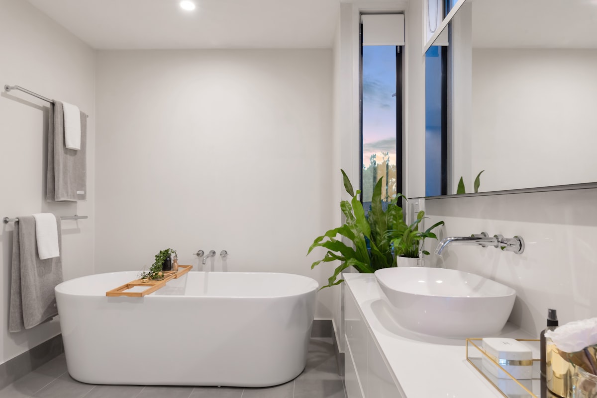 Clean, finished bathroom plumbing work by Bolduc Plumbing